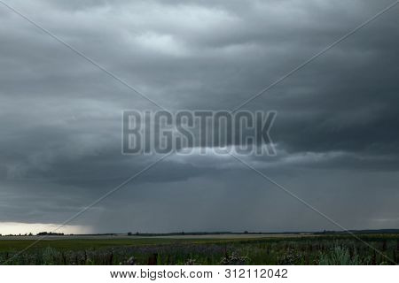 Beautiful storm sky with clouds and field, apocalypse, tunder, tornado