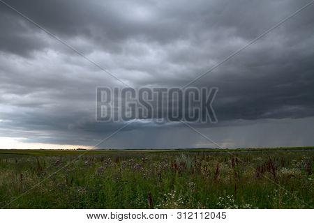 Beautiful storm sky with clouds and field, apocalypse, tunder, tornado