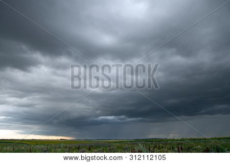 Beautiful storm sky with clouds and field, apocalypse, tunder, tornado