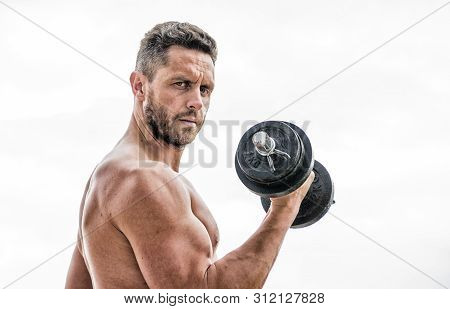Man Sportsman With Strong Hands. Steroids. Fitness And Sport. Muscular Man Exercising In Morning Wit
