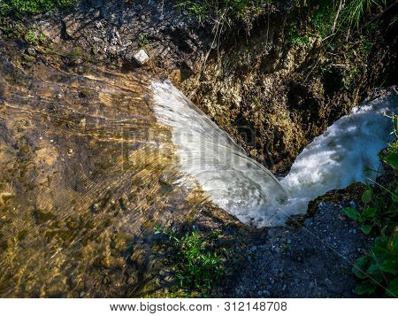 Clean Water Flowing From An Artificial Lake After Heavy Rains In To The Flood Plain.