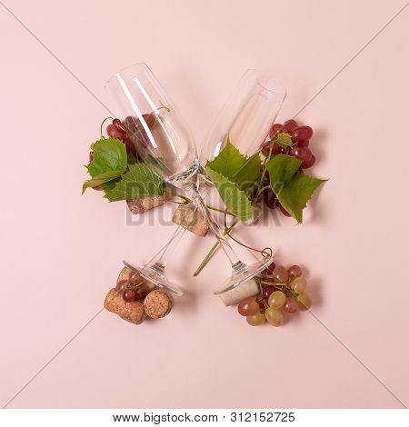 Alphabet. Letter X Made Of Wineglasses With Rose And White Wine, Grapes, Leaves And Corks Lying On P