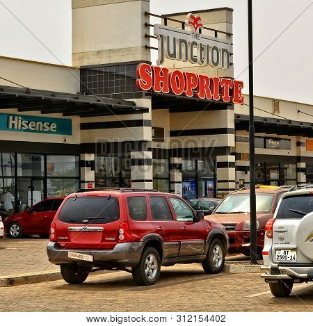 Shopping Center And Cars. Vehicles In A Parking Lot. Shopping Mall. World Brands: Shoprite, Hisense.