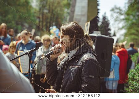 Russia, Siberia, Novokuznetsk - May 9, 2019: Musicians Sing Songs On The Street On Victory Day