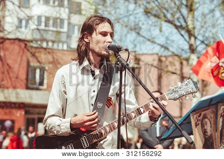 Russia, Siberia, Novokuznetsk - May 9, 2019: Musicians Sing Songs On The Street On Victory Day