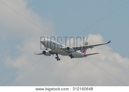 Passenger Airplane Landing At The Airport