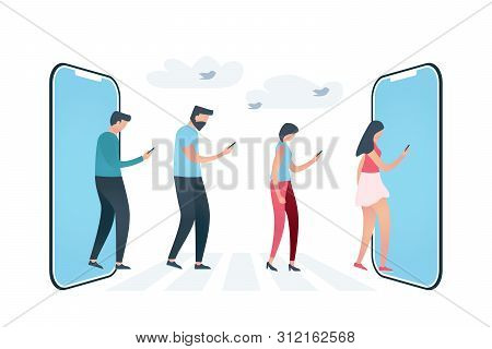 Group Of Four People That Follow Each Other And Looking At Phones, Walking Through Crosswalk Between