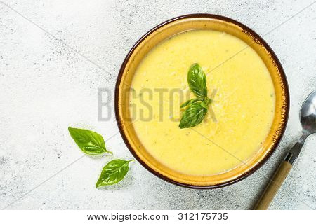 Zucchini Cream Soup. Top View On White Table. Diet Food, Meatless Dish.