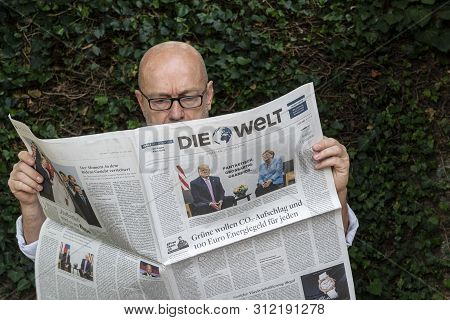 Frankfurt Am Main, Germany. June 29, 2019. A Man Reads The Die Welt  German Newspaper
