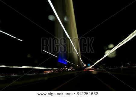 A View Through The Windshield While Driving At Night. Long Exposure. Artistic, Abstract.