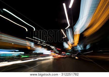 A View Through The Windshield While Driving At Night. Long Exposure. Artistic, Abstract.