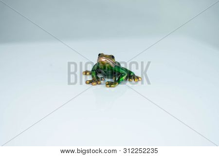Frog Figurine Green, On White Background. Golden Mouth.