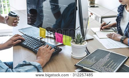 Teamwork Of Professional Programmers Cooperating At Developing Programming And Website Working In A 
