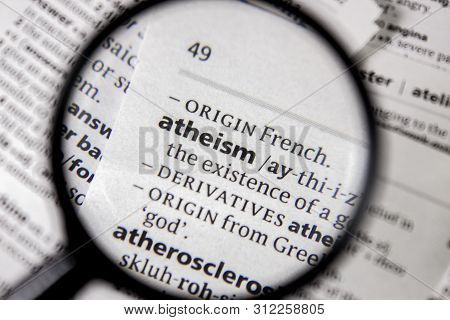 The Word Or Phrase Atheism In A Dictionary Book.