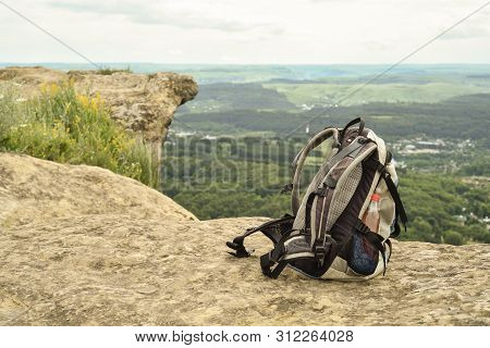 Hipster Hiker Tourist Backpack On Background Nature In Mountain, Blurred Panoramic Landscape, Travel