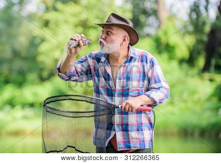 His Favorite Activity. Retired Bearded Fisher. Big Game Fishing. Pothunter. Man Catching Fish. Sport