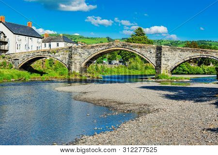 Bridge In Llanwrst, North Wales, United Kingdom, View Of The Buildings Overlooking River Conwy, Sele