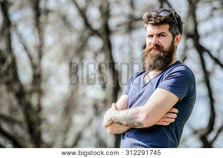 Masculinity And Manliness. Man Attractive Bearded Hipster Posing Outdoors. Confident Posture Of Hand