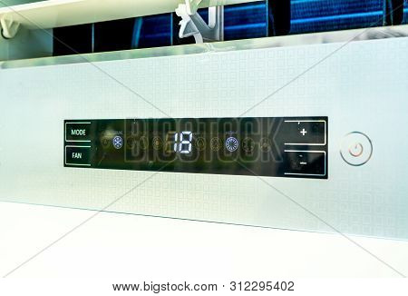 Digital Temperature Control Panel Of Air Conditioner With 18 Degree Celsius And Mode Fan Sign