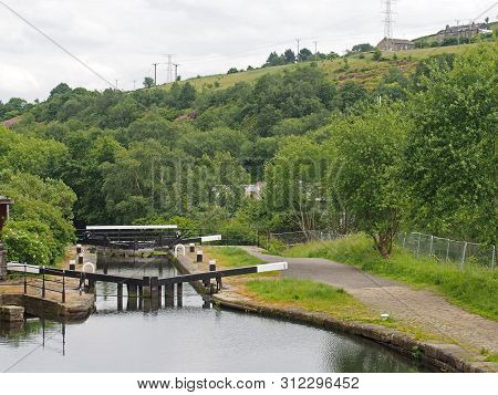 Wooden Lock Gates On The Calder Hand Hebble Navigation Canal In Front Of The Basin In Sowerby Bridge