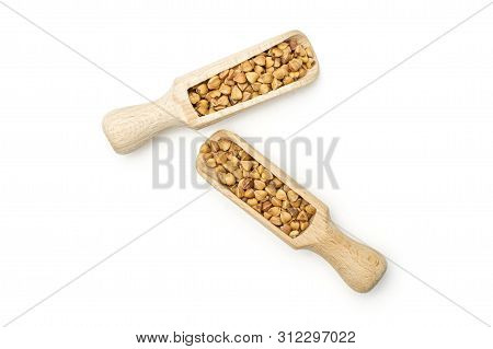 Lot Of Whole Common Raw Brown Buckwheat Grain With Wooden Scoop Flatlay Isolated On White Background