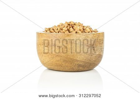 Lot Of Whole Raw Brown Buckwheat Grain In A Wooden Bowl Isolated On White Background