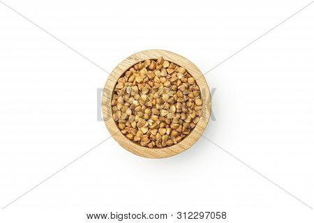 Closeup Of Lot Of Whole Raw Brown Buckwheat Grain In A Wooden Bowl Flatlay Isolated On White Backgro