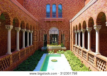 June 29, 2019 In Eugene, Or:  Outdoor Patio Including Columns Alongside A Walkway Surrounding A Cour