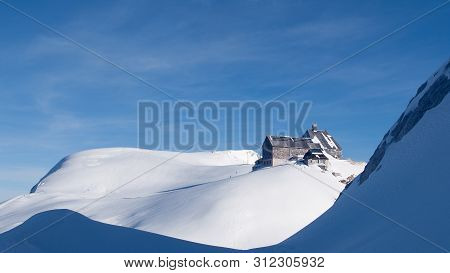 Landscape View Of The Mountain Hut Kredarica From The. Winter In Julian Alps, Slovenia, Europe.