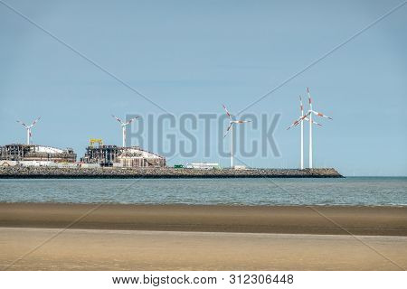 Zeebrugge, Flanders, Belgium -  June 18, 2019: Closeup Of Lng Terminal In Port Of Zeebrugge Under Bl