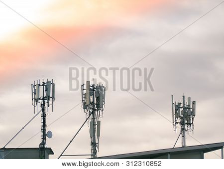 Lte, Gsm, 2g, 3g, 4g, 5g Tower Of Cellular Communication On The Roof. Telecommunication Tower Agains