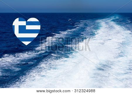 Heart Shaped Greek Flag On Background Made Of View Of Deep Blue Mediterranian Sea With Kelvou Jet, B