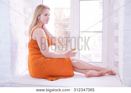 Pretty Plus Size Caucasian Woman Drink Wine In The Morning Alone At Home