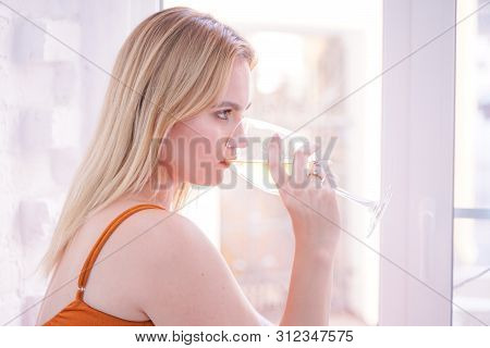 Pretty Plus Size Caucasian Woman Drink Wine In The Morning Alone At Home