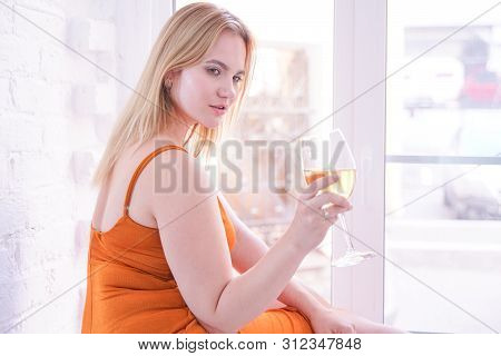 Pretty Plus Size Caucasian Woman Drink Wine In The Morning Alone At Home