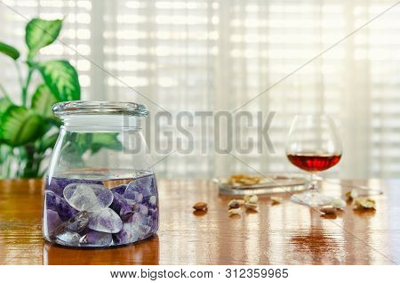 Combination of two stones used in the preparation of gem elixir. Amethyst and clear quartz are placed into a glass jar filled with clean water. This homeopathic remedy helps to get over the hangover.
