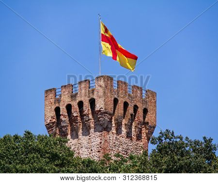 Tower Of Carrarese Castle In Este, Red And Yellow Flag. Padova, Italy