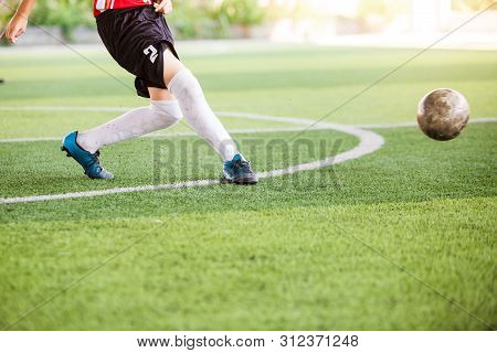 Soccer Player Speed Run On Green Artificial Turf To Shoot Ball To Goal. Boy Soccer Player Is Trainin