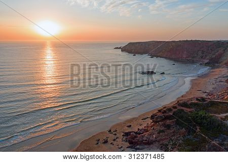 Aerial on Praia Amado on the west coast in Portugal at sunset