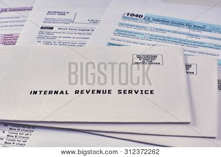 Three Mails From The Internal Revenue Service Lie On 1040, Schedule D Form 1040 And 1040a Tax Forms