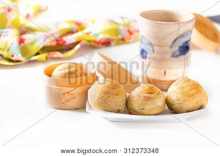 Oriental Food Concept Homemade Organic Huaiyang Spiral Chinese Flaky  Pastry Moon Cake On White Back