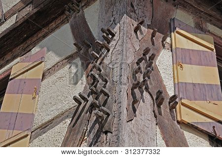 Corner At Facade Of Historic Building With Treenails In Beams Of Timber Framing