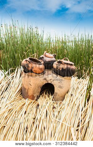Traditional outdoor kitchen on Uros floating Uros islands at  Titicaca lake, Peru. South America.