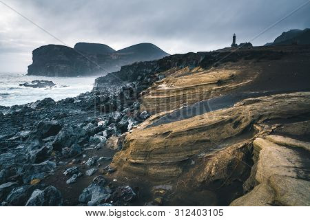 View Over Capelinhos Volcano, Lighthouse Of Ponta Dos Capelinhos On Western Coast On Faial Island, A