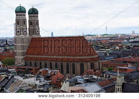 View On Munich Frauenkirche Surrounded By Residential Houses