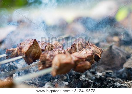 Grilled Shish Kebab On Skewer. Roasted Beef Meat Cooked At Barbecue. Traditional Eastern Dish Shashl