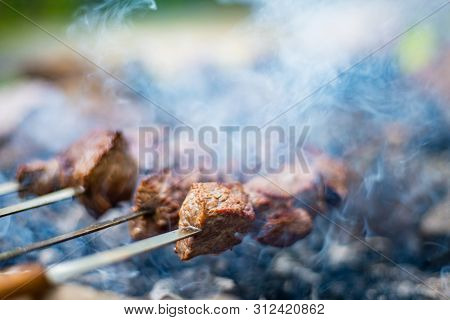 Grilled Shish Kebab On Skewer. Roasted Beef Meat Cooked At Barbecue. Traditional Eastern Dish Shashl