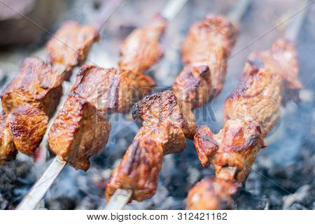 Grilled Shish Kebab On Skewer. Roasted Beef Meat Cooked At Barbecue. Traditional Eastern Dish Shashl