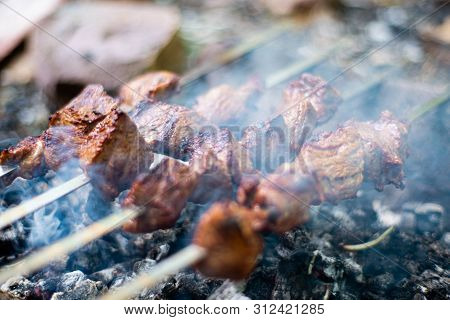 Grilled Shish Kebab On Skewer. Roasted Beef Meat Cooked At Barbecue. Traditional Eastern Dish Shashl