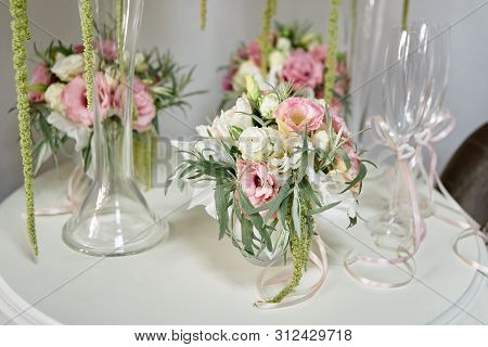 Luxury Floral Arrangement Of Pink And White Flowers In Glass Vases On Wood Table, Copy Space. Weddin